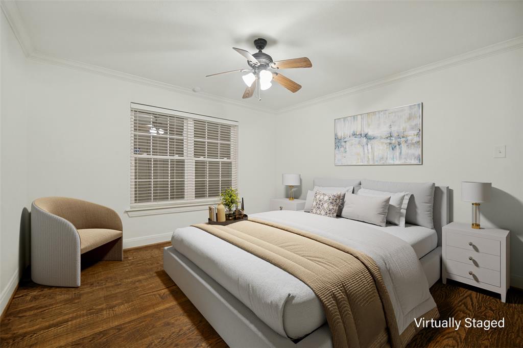 Wood-finish flooring, crown molding, double-paned window, and a ceiling fan with integrated lighting Wood-finish flooring, crown molding, double-paned window, and a ceiling fan with integrated lighting