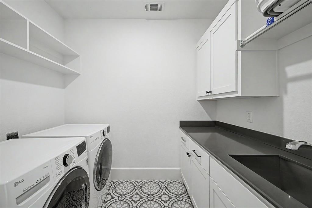Upstairs laundry room with sink