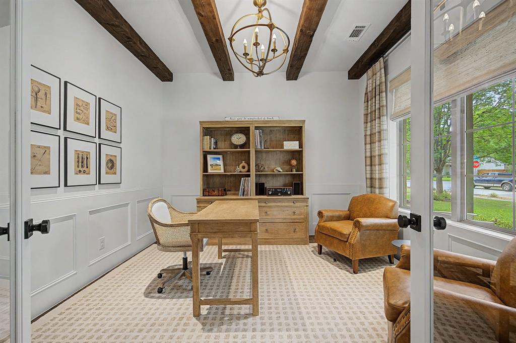 Office with exposed wood beams