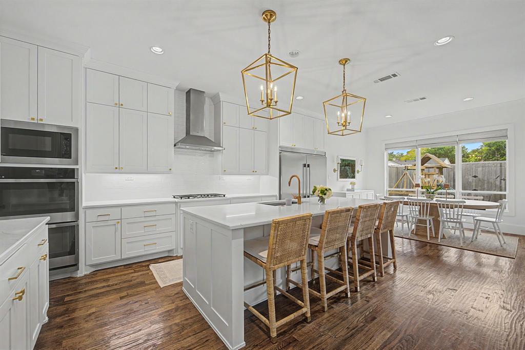 Kitchen with double ovens and walk-in pantry