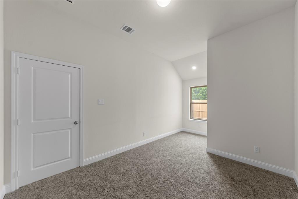 Neutral wall finishes with a single window, recessed lighting, and carpet flooring