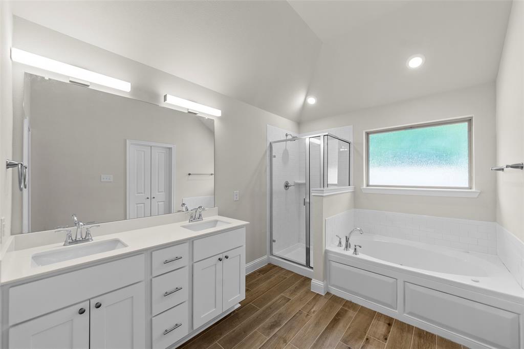 Dual vanity with undermount sinks and white shaker cabinetry