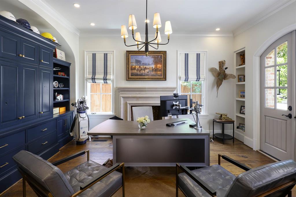 Study with gas fireplace, built-in cabinetry and access to front patio