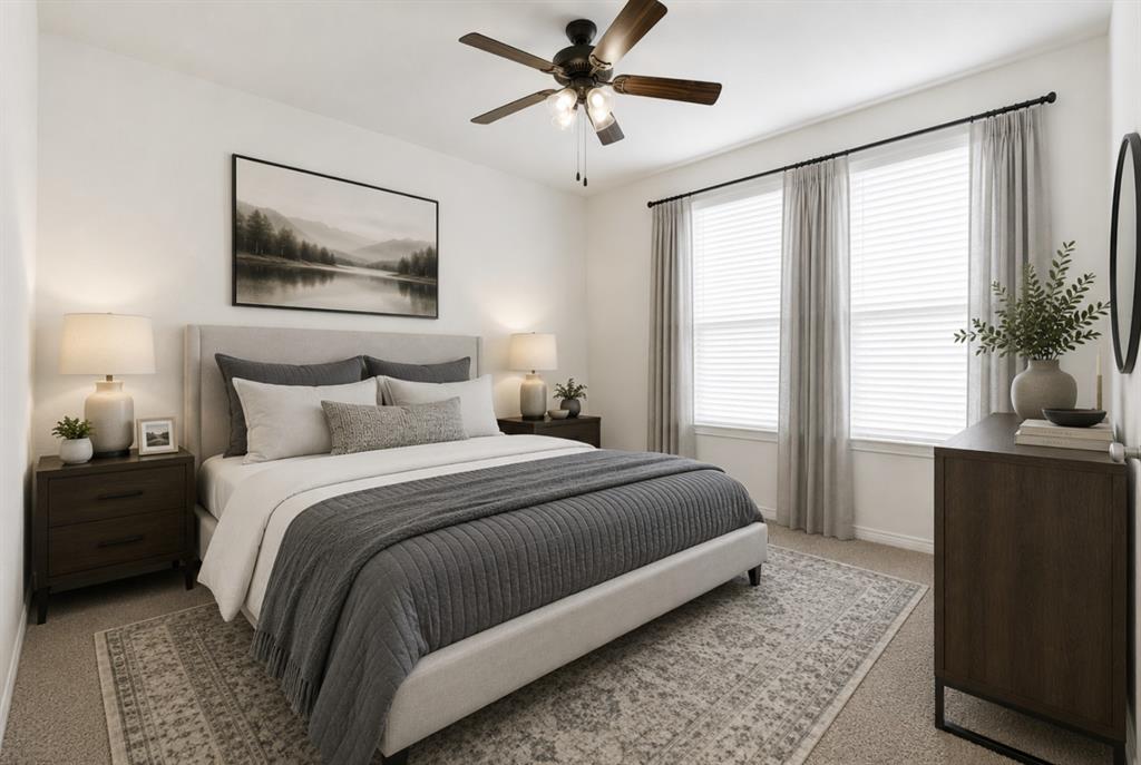 A clean angle reveals plush carpet, soft natural light, and a stylish ceiling fan fixture in this flexible secondary bedroom. Enjoy configuring this quiet, inviting space into a dream nursery, guest retreat, or personal studio. *Virtually Staged*