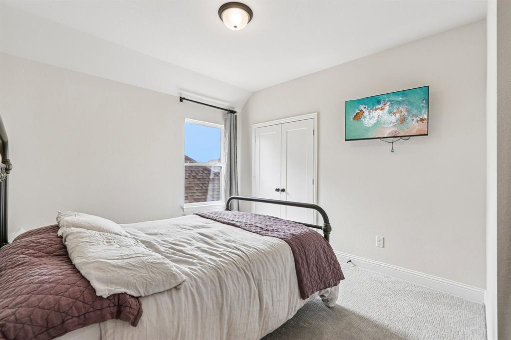 Recessed window with dark curtain rod, ceiling-mounted light fixture, and carpeted flooring