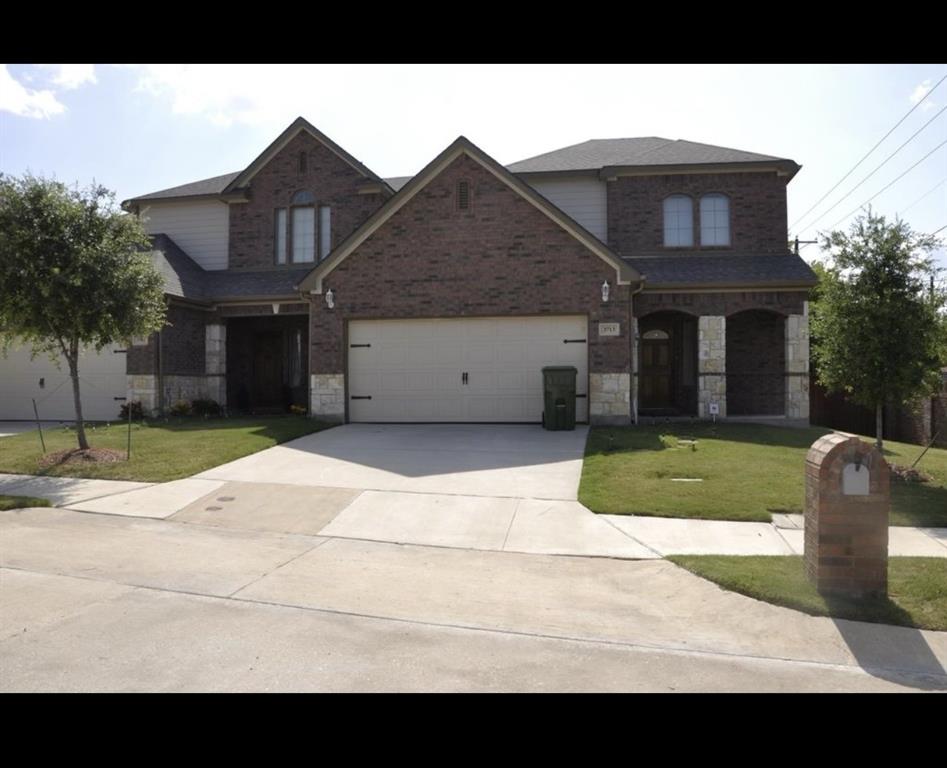 Brick and stone veneer exterior with gabled roof lines