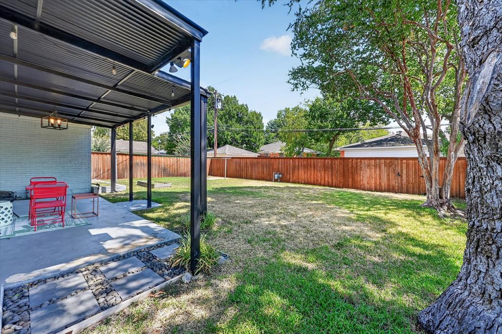 Covered back patio that overlooks the yard