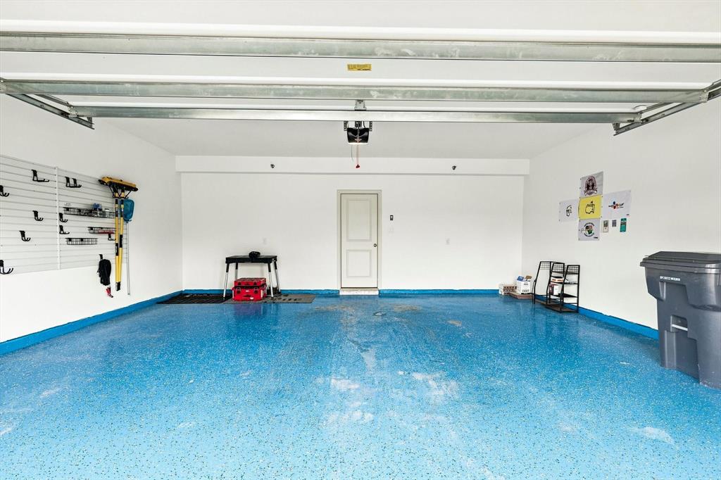 Even the garage gets an upgrade. A spacious two-car garage with wall-mounted organization and a finished floor adds both function and a clean, polished feel. Even the garage gets an upgrade. A spacious two-car garage with wall-mounted organization and a finished floor adds both function and a clean, polished feel.