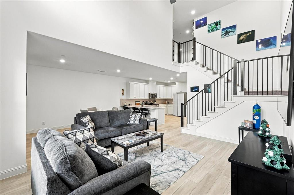 Designed to impress and made for everyday living—the dramatic living room flows seamlessly into the kitchen and dining areas for effortless entertaining.