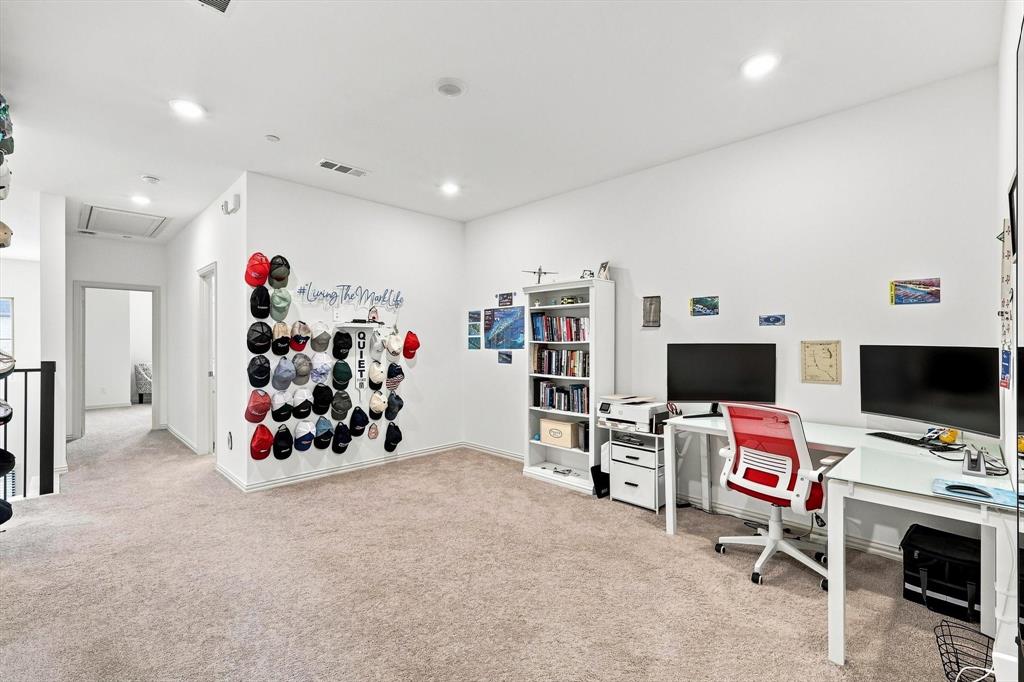 A spacious second living area with room for multiple workstations, lounge furniture, or entertainment setups makes this home exceptionally versatile.