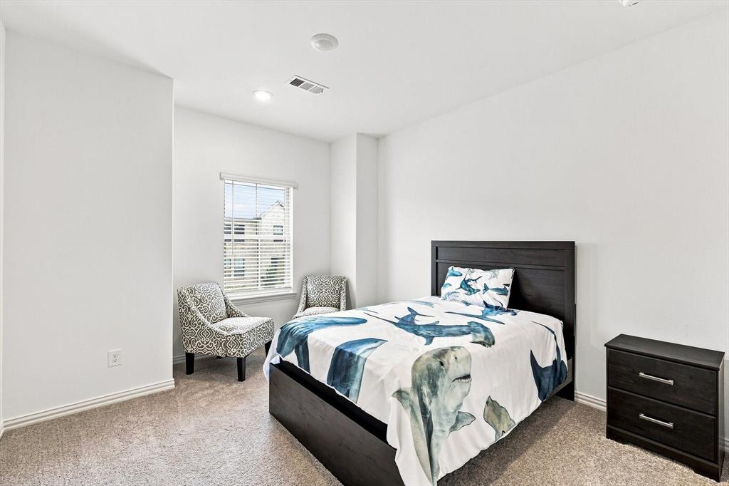 Bright, spacious, and inviting, this secondary bedroom offers plenty of room to unwind, recharge, or create a personalized retreat.