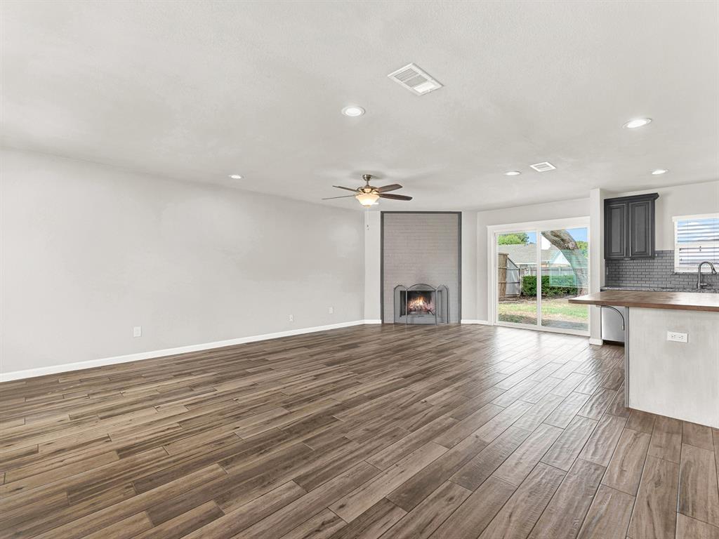 Open concept living at it's best- living room, kitchen, breakfast bar, and dining area