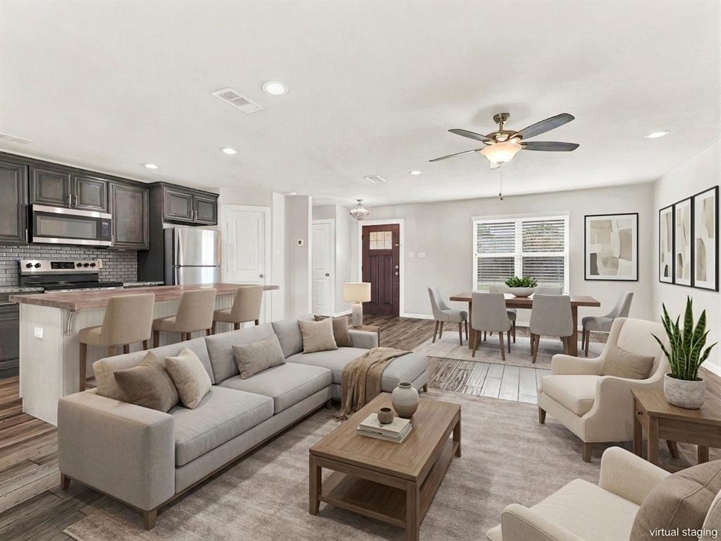 Open concept living at it's best- living room, kitchen, breakfast bar, and dining area Open concept living at it's best- living room, kitchen, breakfast bar, and dining area