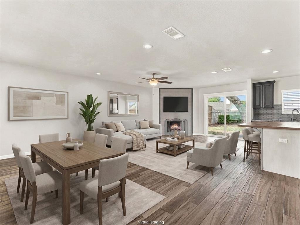 Open concept living at it's best- living room, kitchen, breakfast bar, and dining area