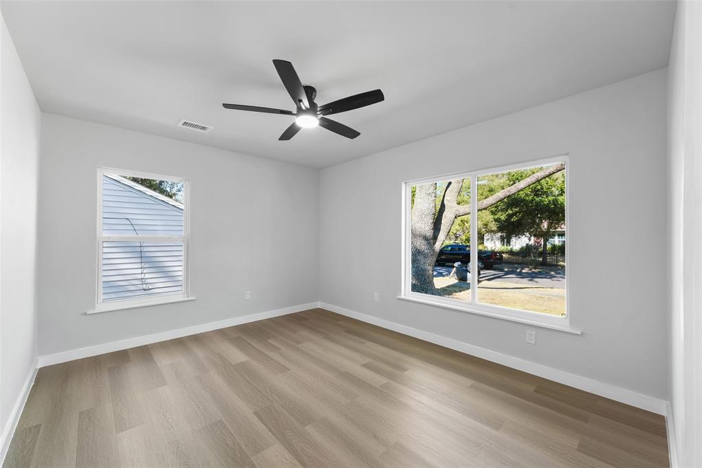 Recessed ceiling fan, wood-finish flooring, and multiple windows Recessed ceiling fan, wood-finish flooring, and multiple windows