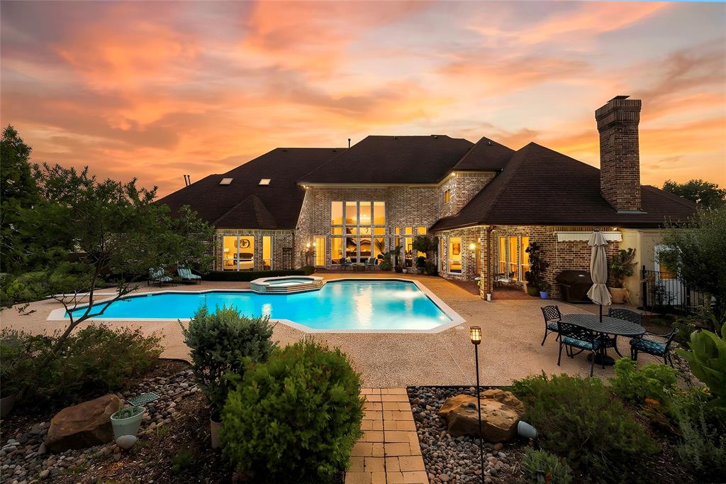 Expansive landscaped backyard offering privacy, mature trees, and room to enjoy the outdoors.