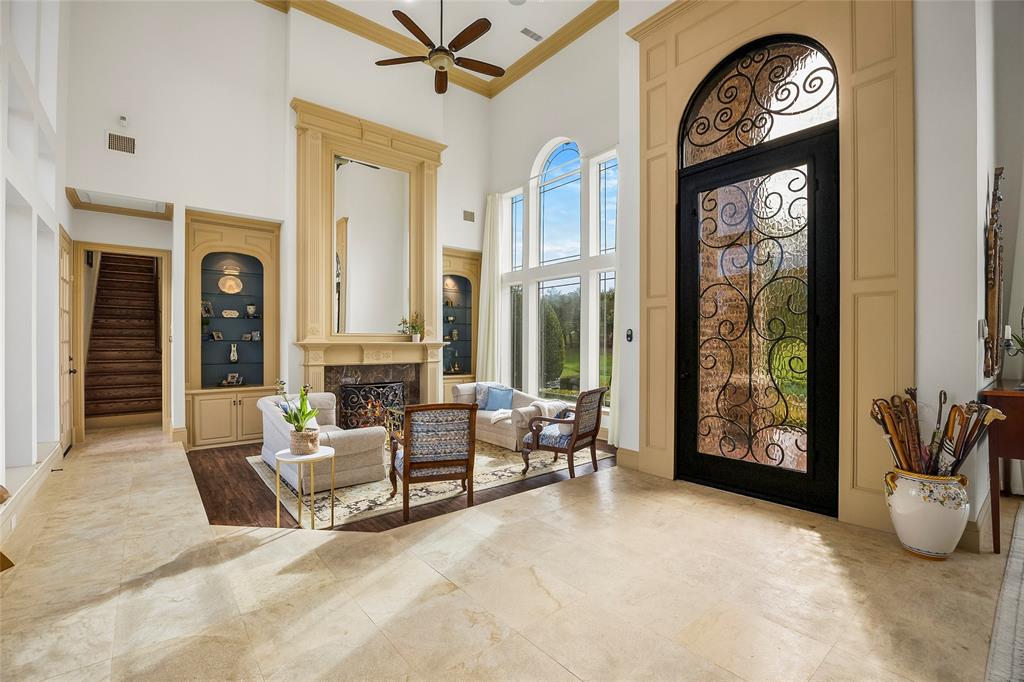Grand two-story entry featuring beautiful millwork and abundant natural light. Grand two-story entry featuring beautiful millwork and abundant natural light.