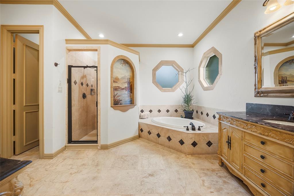 Elegant bathroom featuring a spacious walk-in shower and refined finishes.