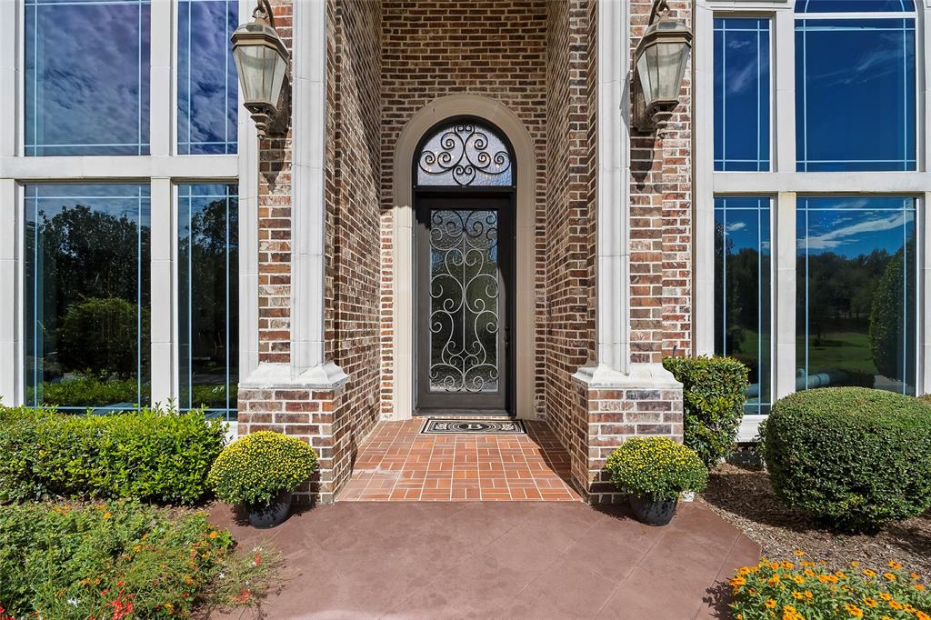 Inviting entrance showcasing timeless brick architecture and elegant curb appeal. Inviting entrance showcasing timeless brick architecture and elegant curb appeal.