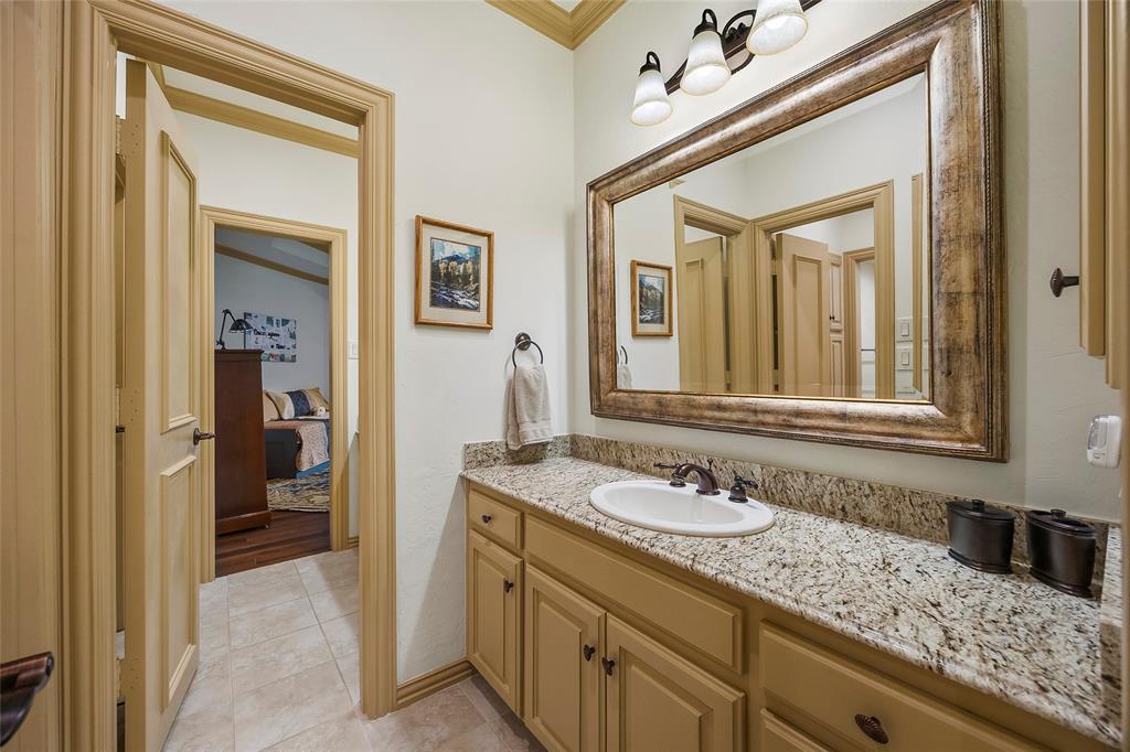 Elegant bathroom with custom cabinetry, generous counter space, and timeless finishes.