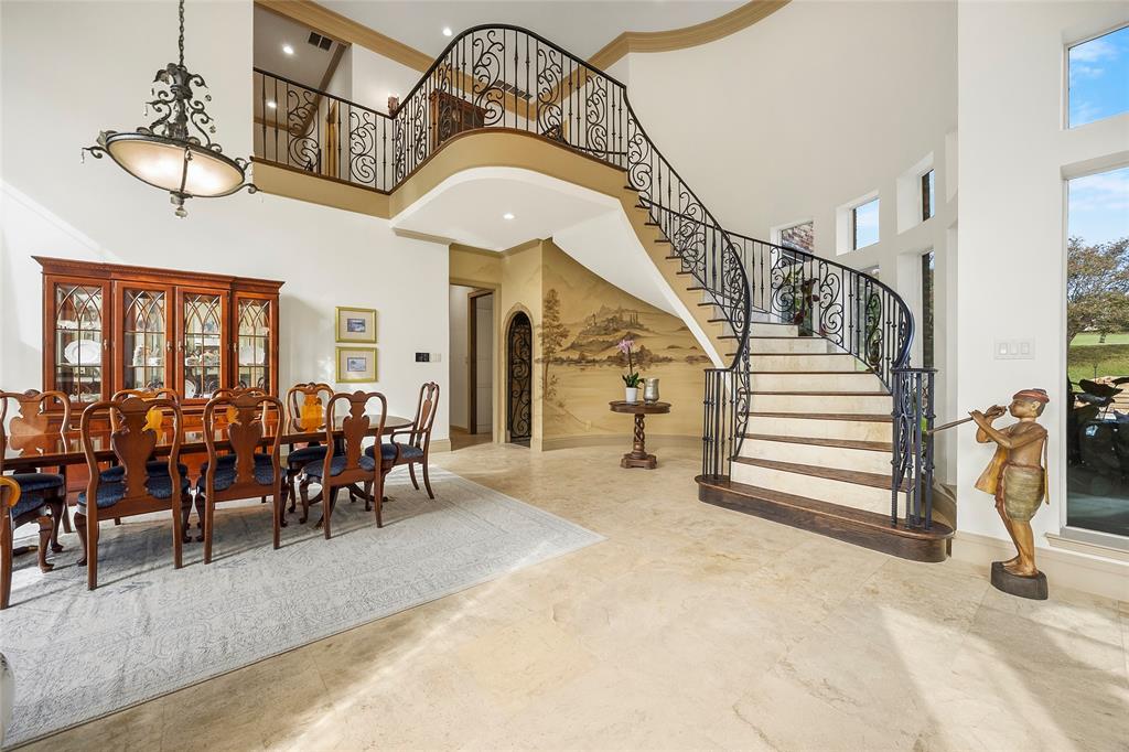 Elegant formal dining room with soaring ceilings and architectural detailing. Elegant formal dining room with soaring ceilings and architectural detailing.
