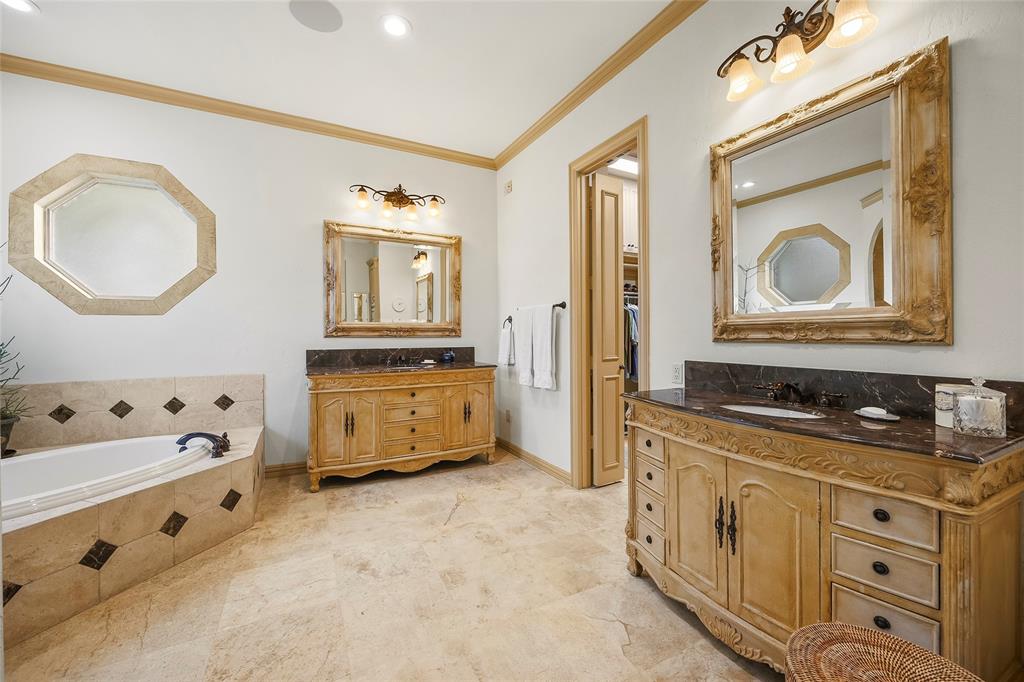 Beautifully appointed bathroom with dual vanities and custom cabinetry.
