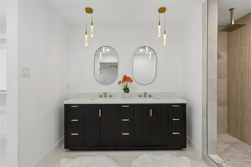 Dual vanity with a white countertop and undermount sinks