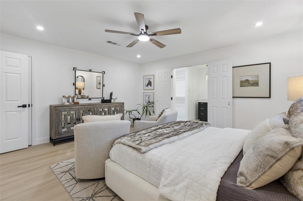 Recessed lighting, wood-finish flooring, ceiling fan, white paneled doors, and matte black door hardware