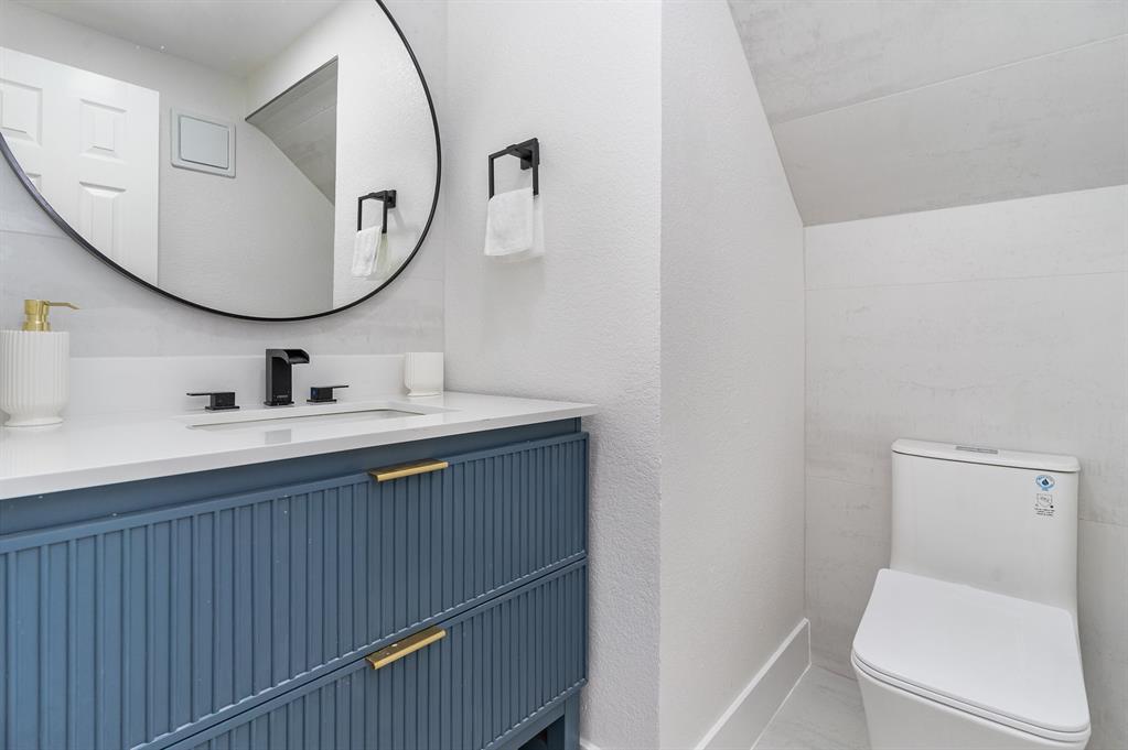 Bathroom featuring toilet and vanity