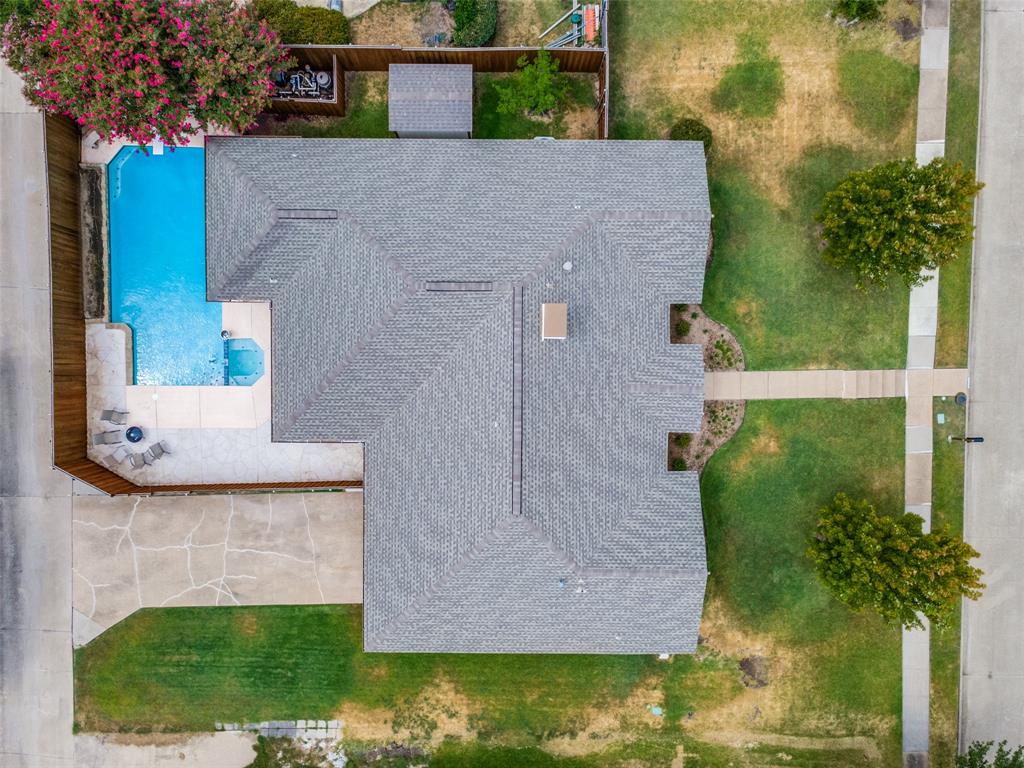 Private backyard with a swimming pool and attached spa
