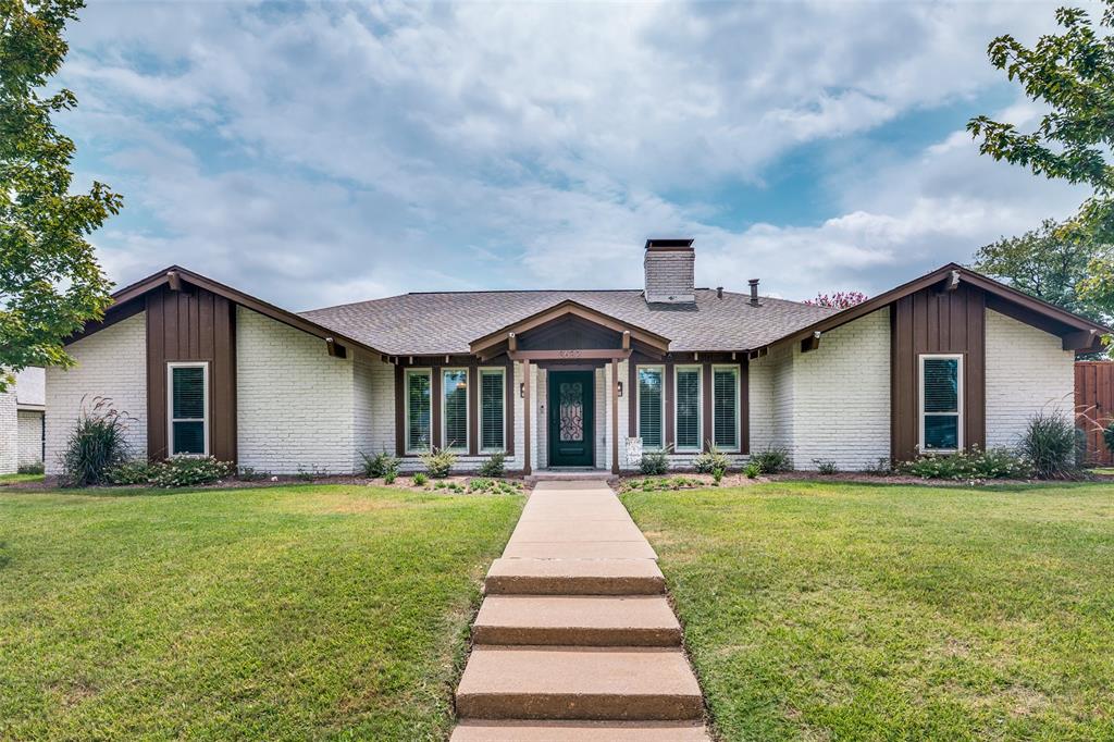 White brick exterior with brown wood-finish siding accents