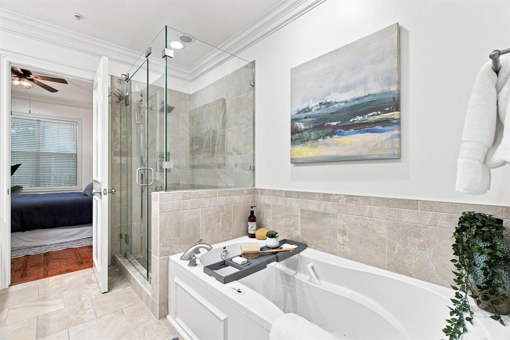 Primary bathroom with soaking tub and separate large shower.