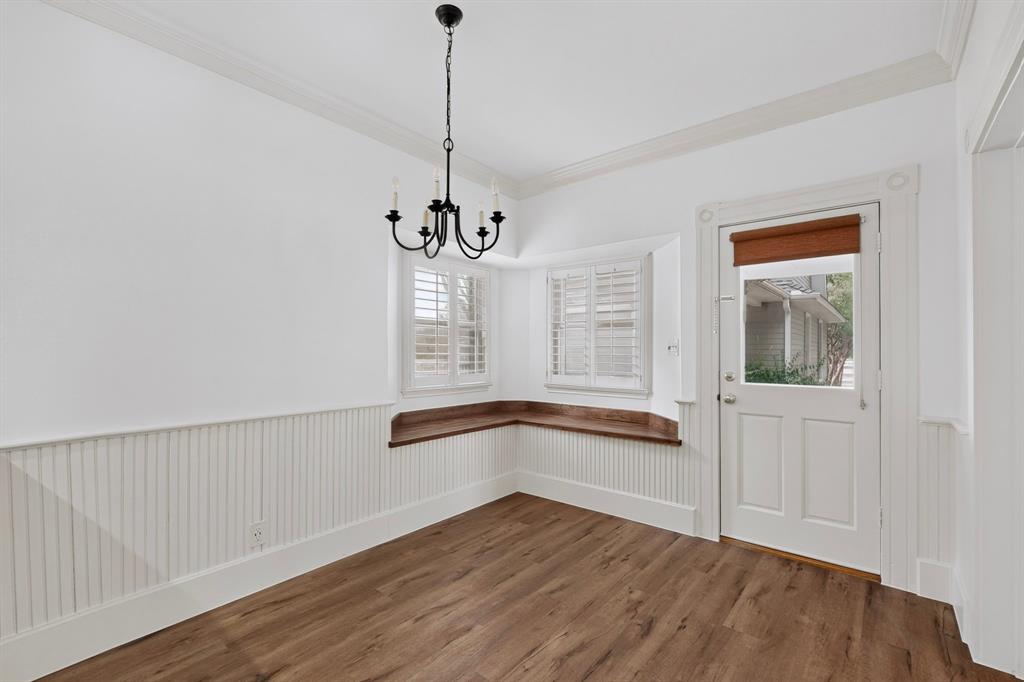 Wood-finish flooring with white beadboard wainscoting