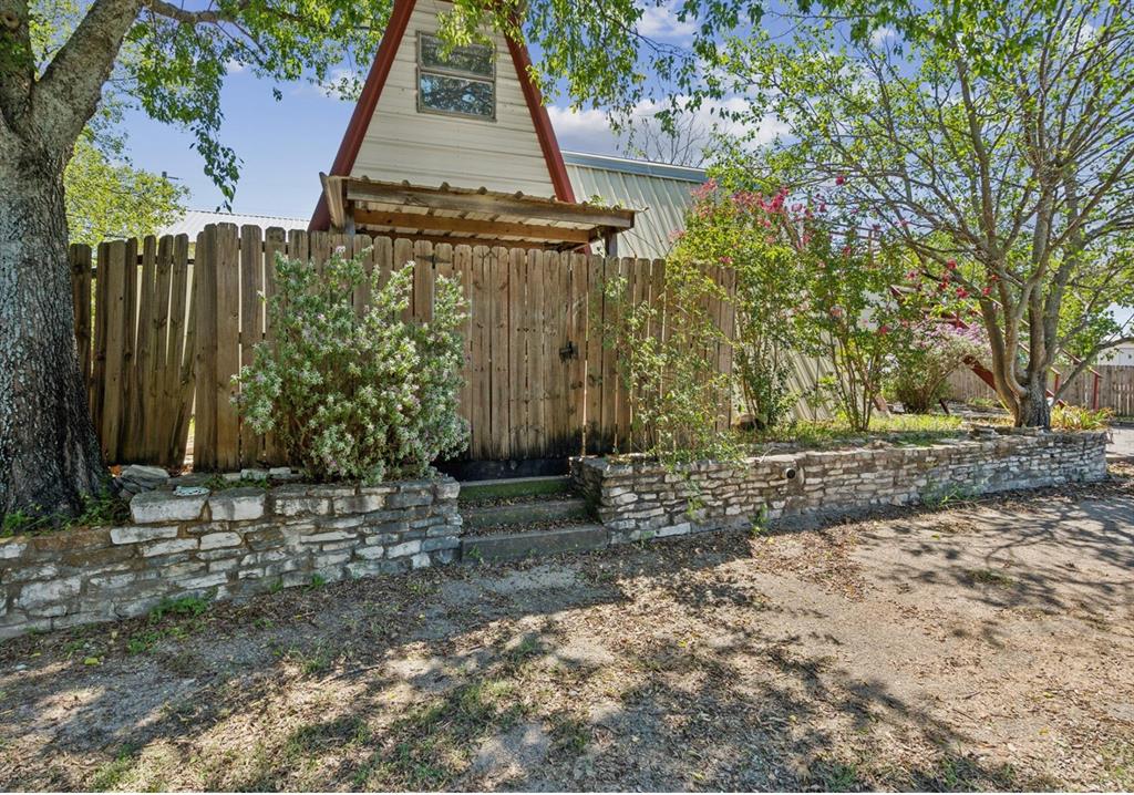 View of yard featuring fence