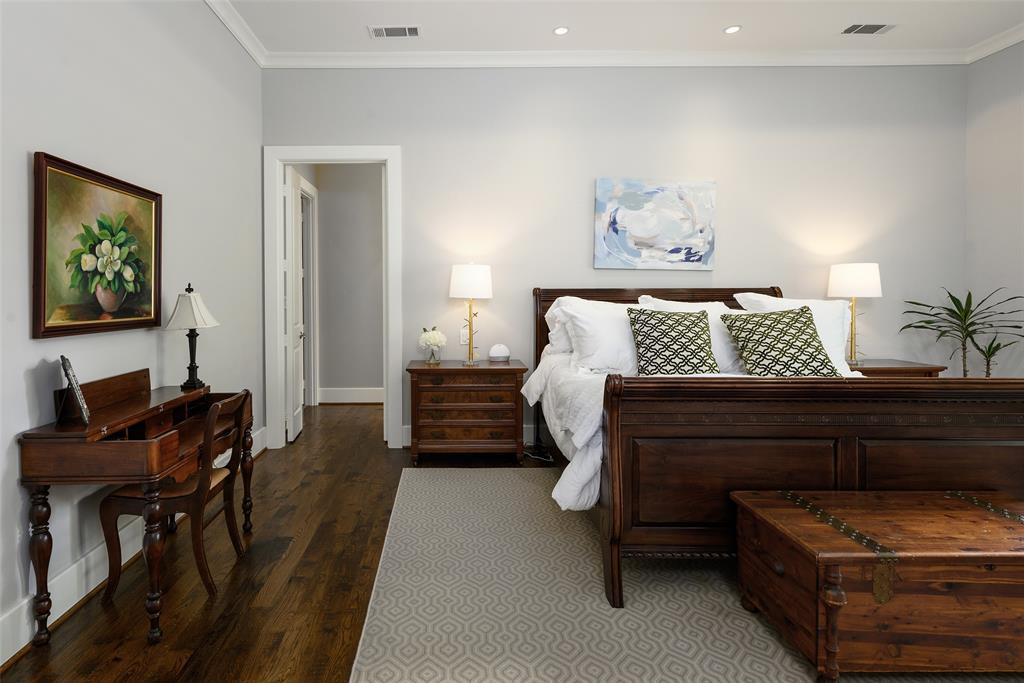 Hardwood flooring, recessed lighting, crown molding, and a wide entryway