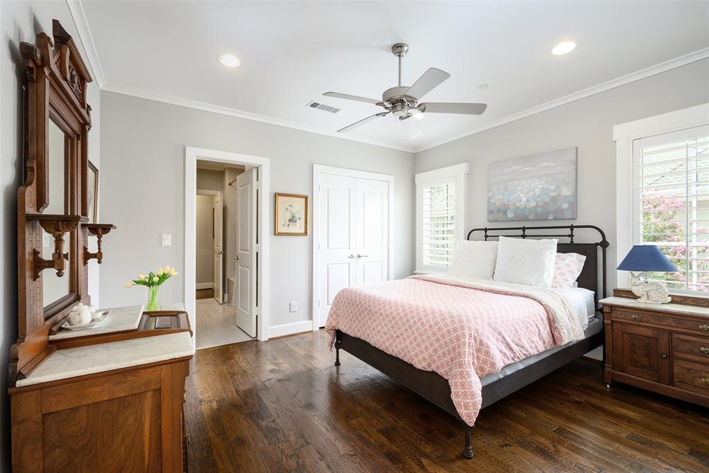 Hardwood flooring, crown molding, plantation shutters, ceiling fan with integrated lighting, and recessed lighting