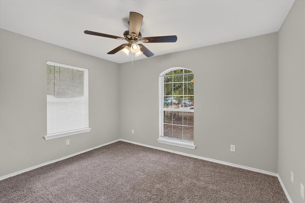 Neutral paint palette and brown carpet flooring