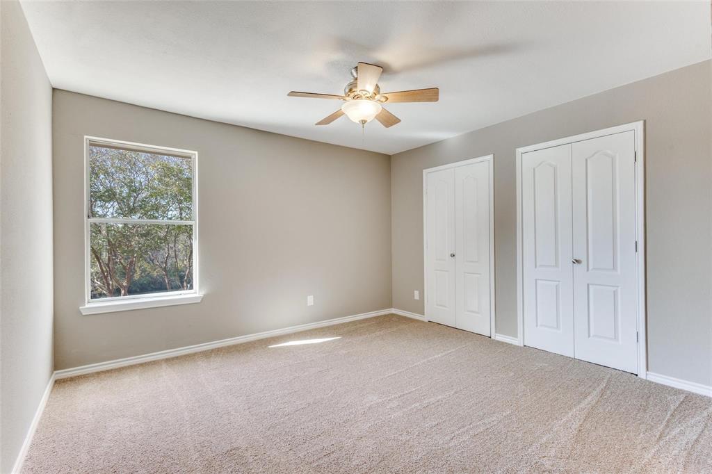 Bedoom upstairs - Neutral color palette, NEW carpeted, ceiling fan with light fixture, large closet.