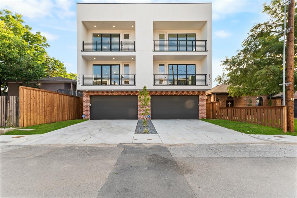 Modern facade with white stucco and brick accents