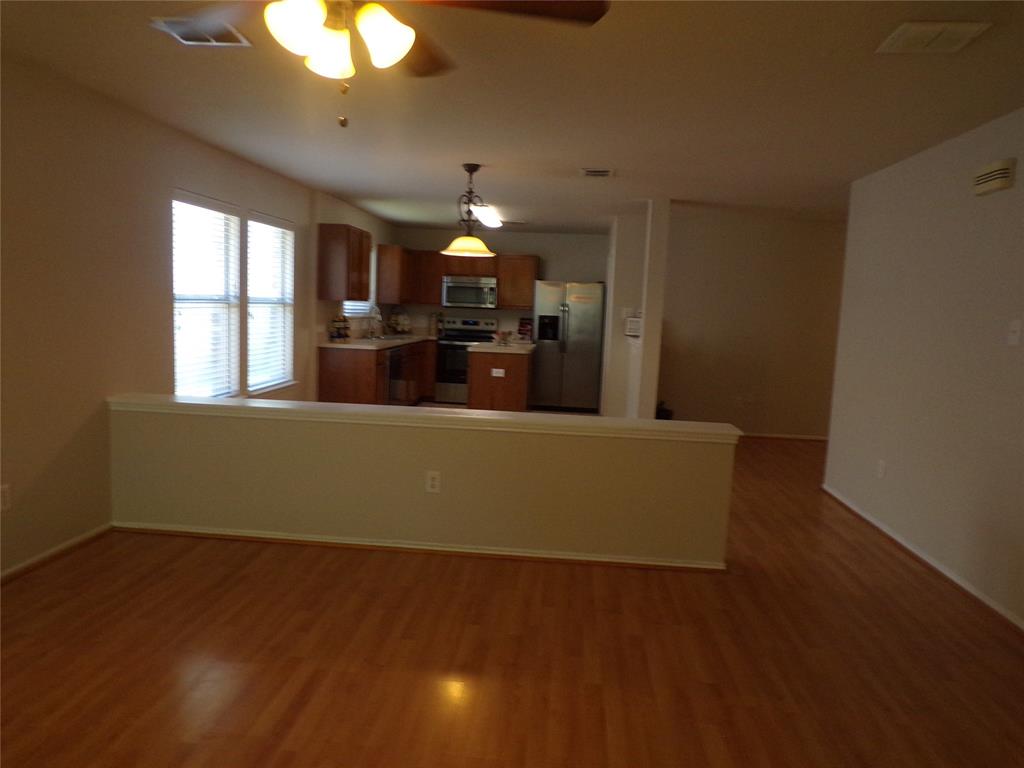 View from living area into breakfast nook and kitchen View from living area into breakfast nook and kitchen