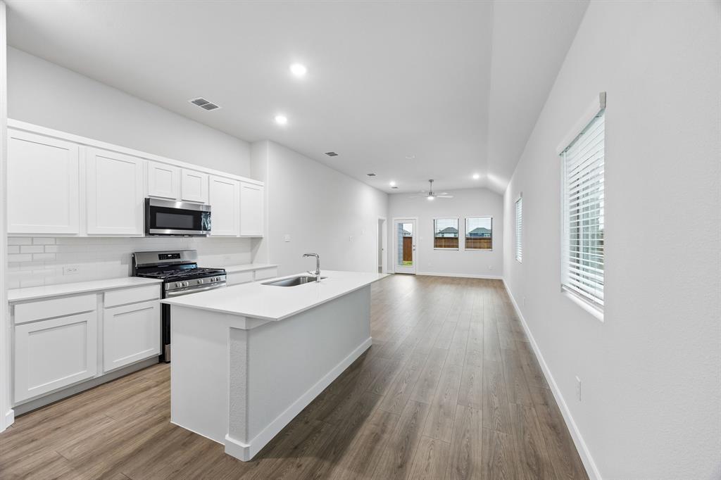 Kitchen in the Cedar home plan by Trophy Signature Homes – REPRESENTATIVE PHOTO