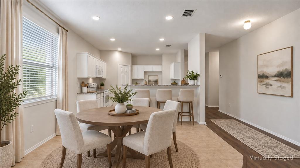 Plenty of Room for Casual Dining – The spacious breakfast area sits directly beside the kitchen with a large window bringing in natural light, offering an inviting spot for morning coffee, everyday meals, or a larger dining table.
