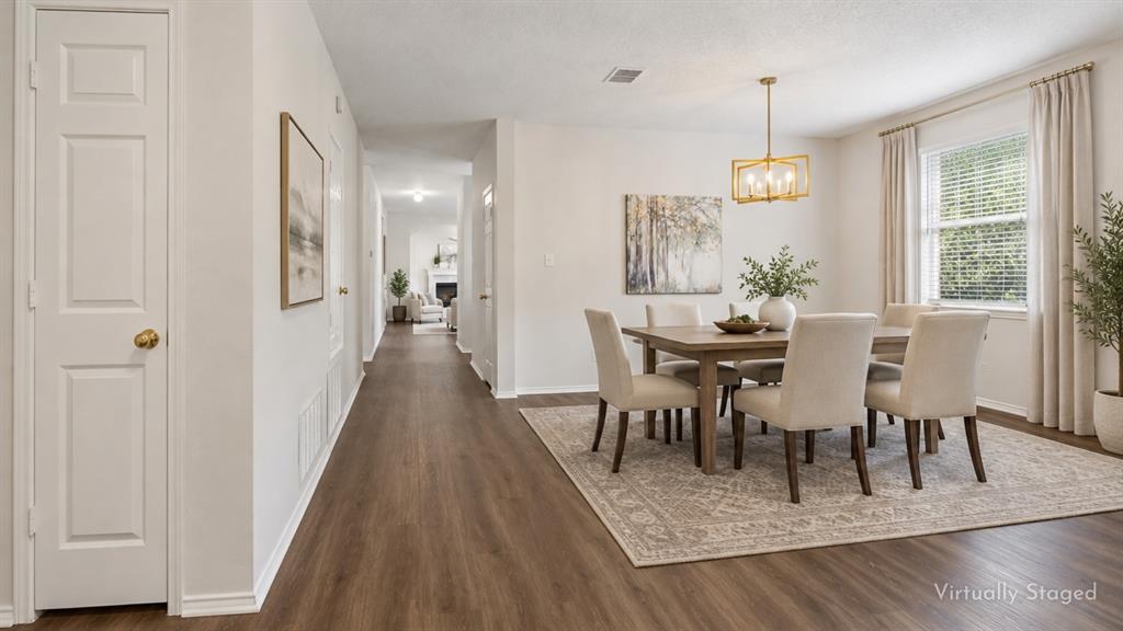 An Entry That Opens Up the Home – LVP flooring begins at the front door and continues through the main living spaces, creating an easy visual flow from the entry toward the heart of the home.