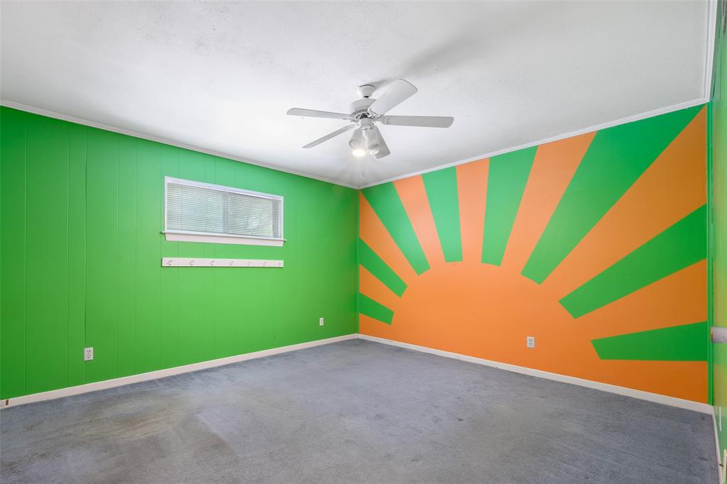 Recessed window, ceiling fan, and paneled accent wall