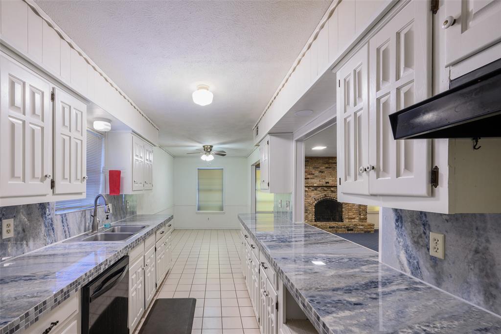 White cabinetry with decorative paneling