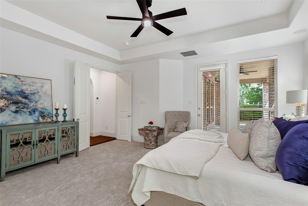 Tray ceiling with a ceiling fan, recessed lighting, and light-tone carpeting