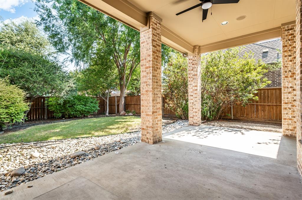 Covered patio featuring a ceiling fan, recessed lighting, and brick columns