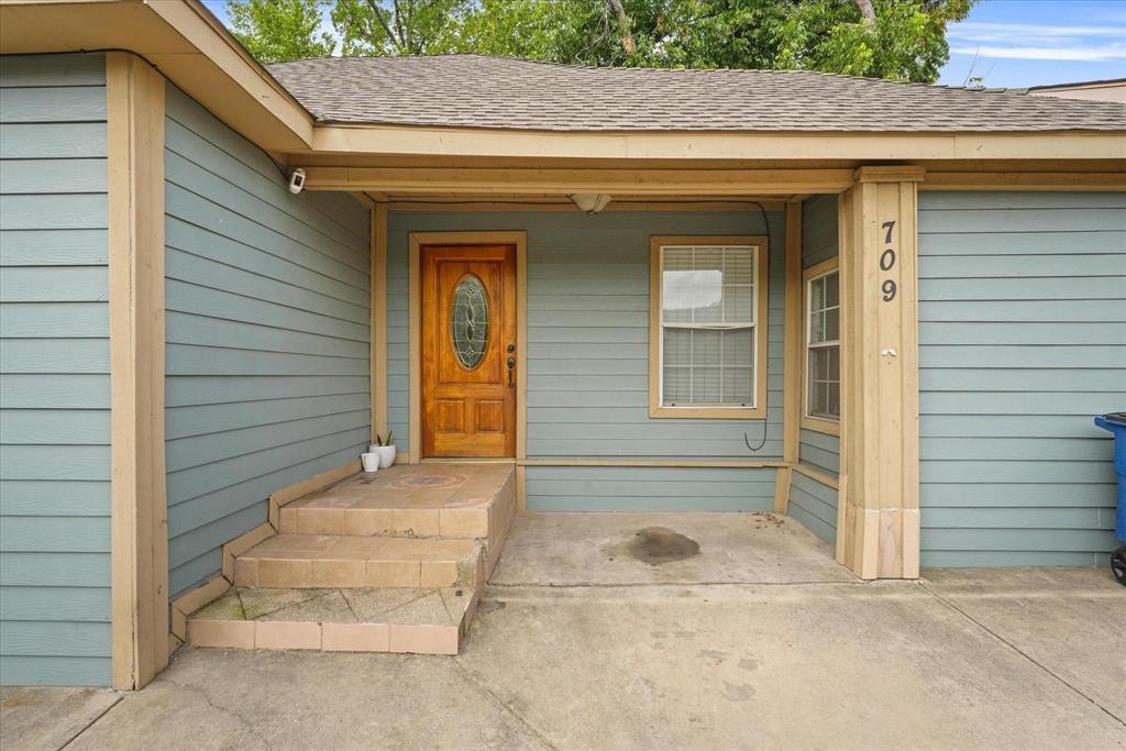 Light blue siding exterior with tan trim accents