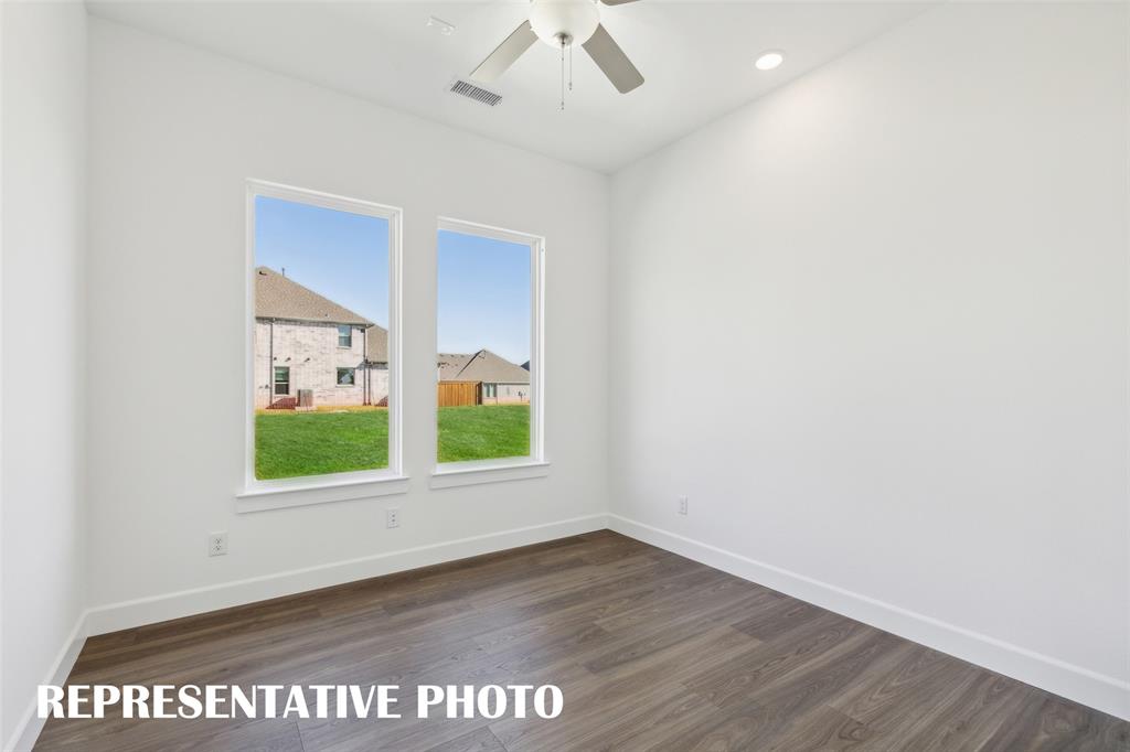 The professional needing to work from home will appreciate this light filled, private home office.  REPRESENTATIVE PHOTO