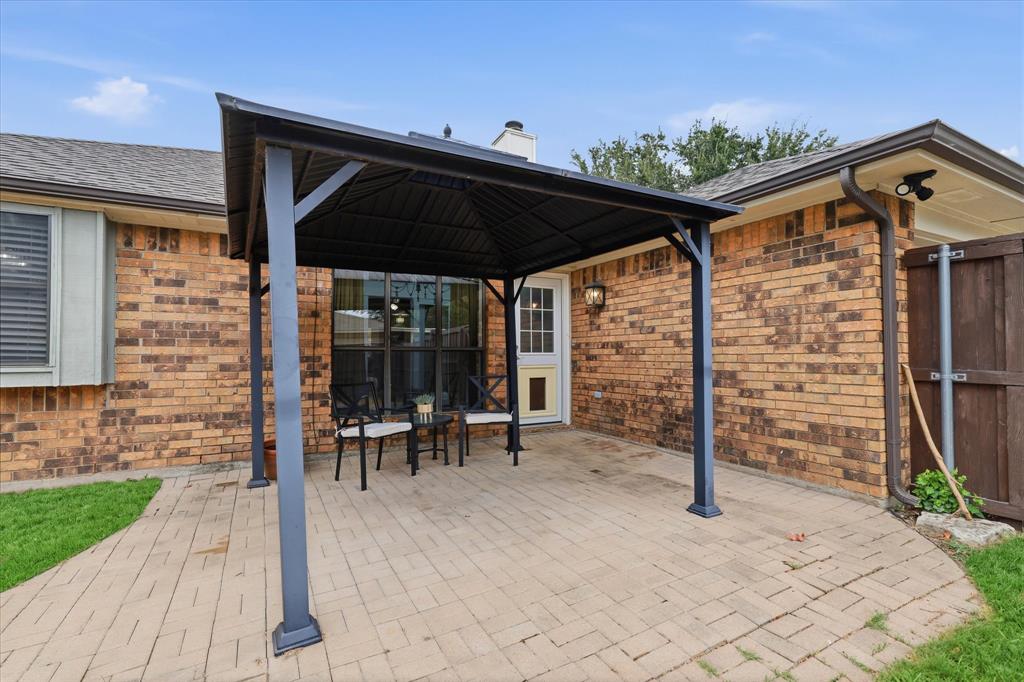 Covered patio extends the living space outdoors and offers a comfortable spot for dining, relaxing or entertaining.